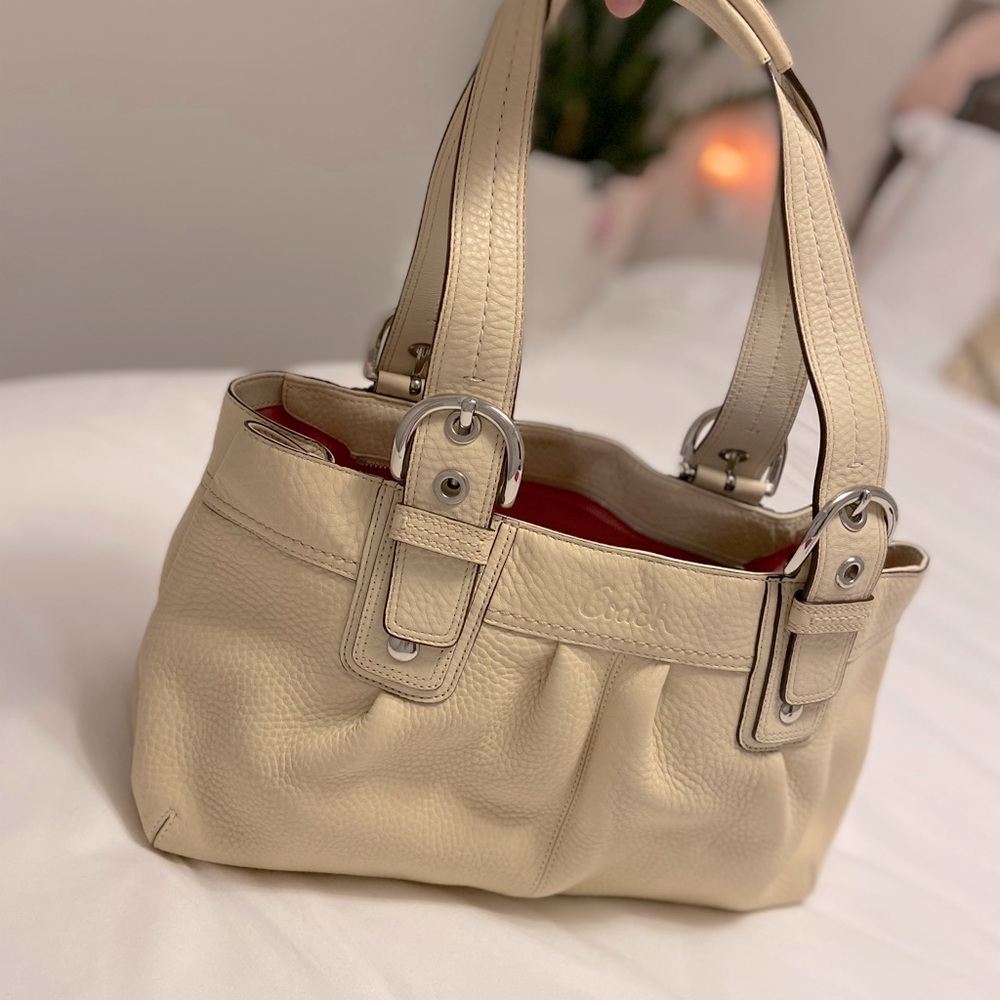 Cream Coach handbag.